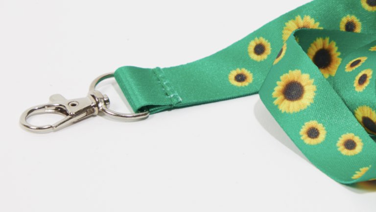 Keyhanger med grøn snor og solsikker